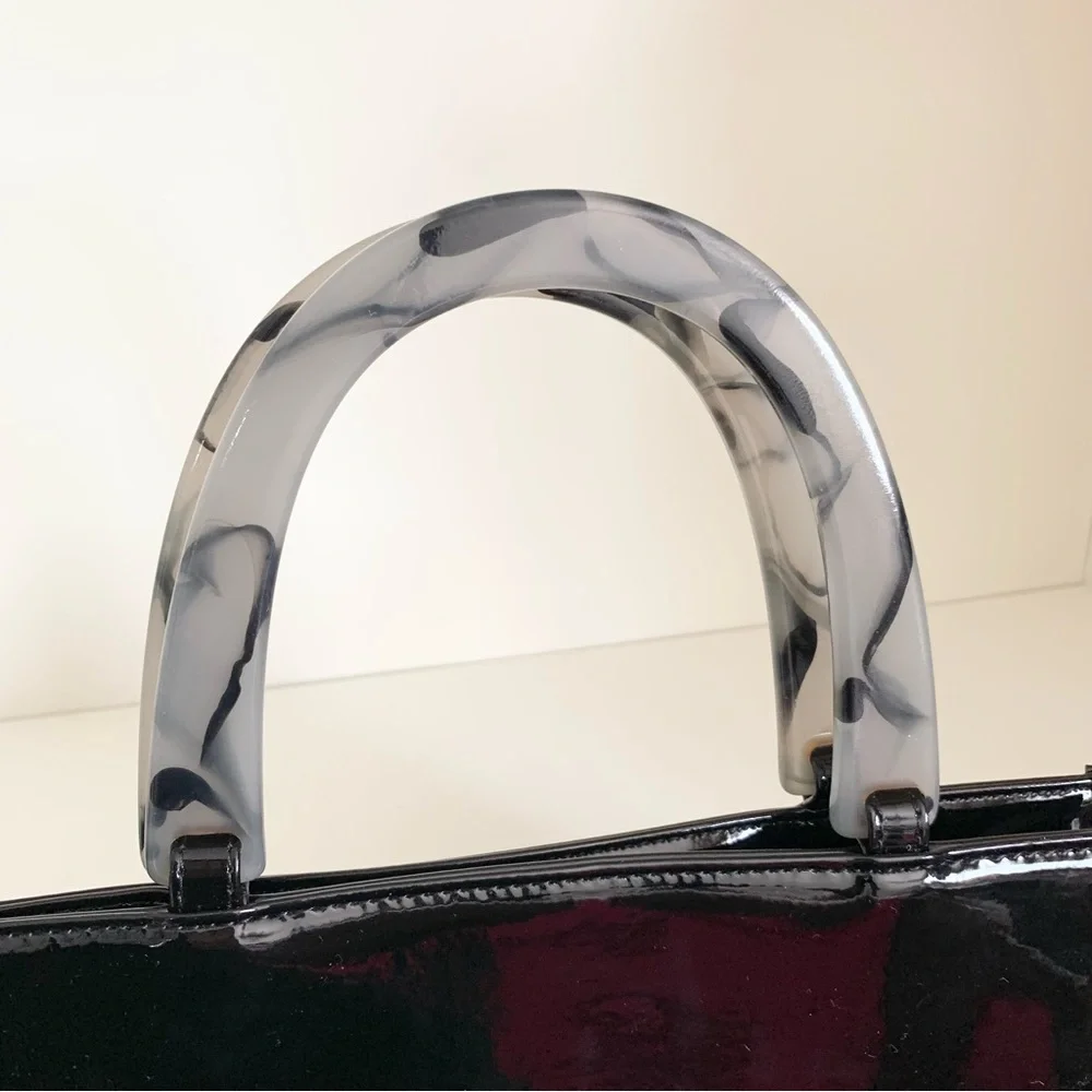 Hold NWOT Neiman Marcus black patent marble handle modern bag